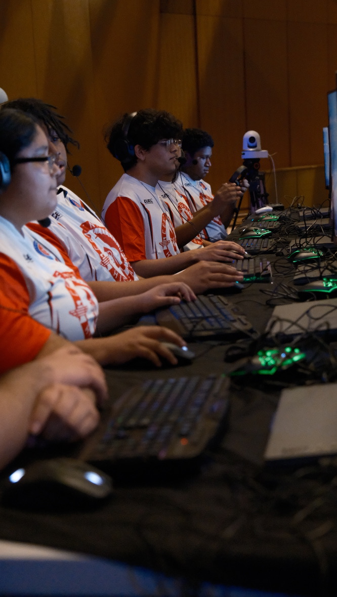 Students competing at gaming stations during the event