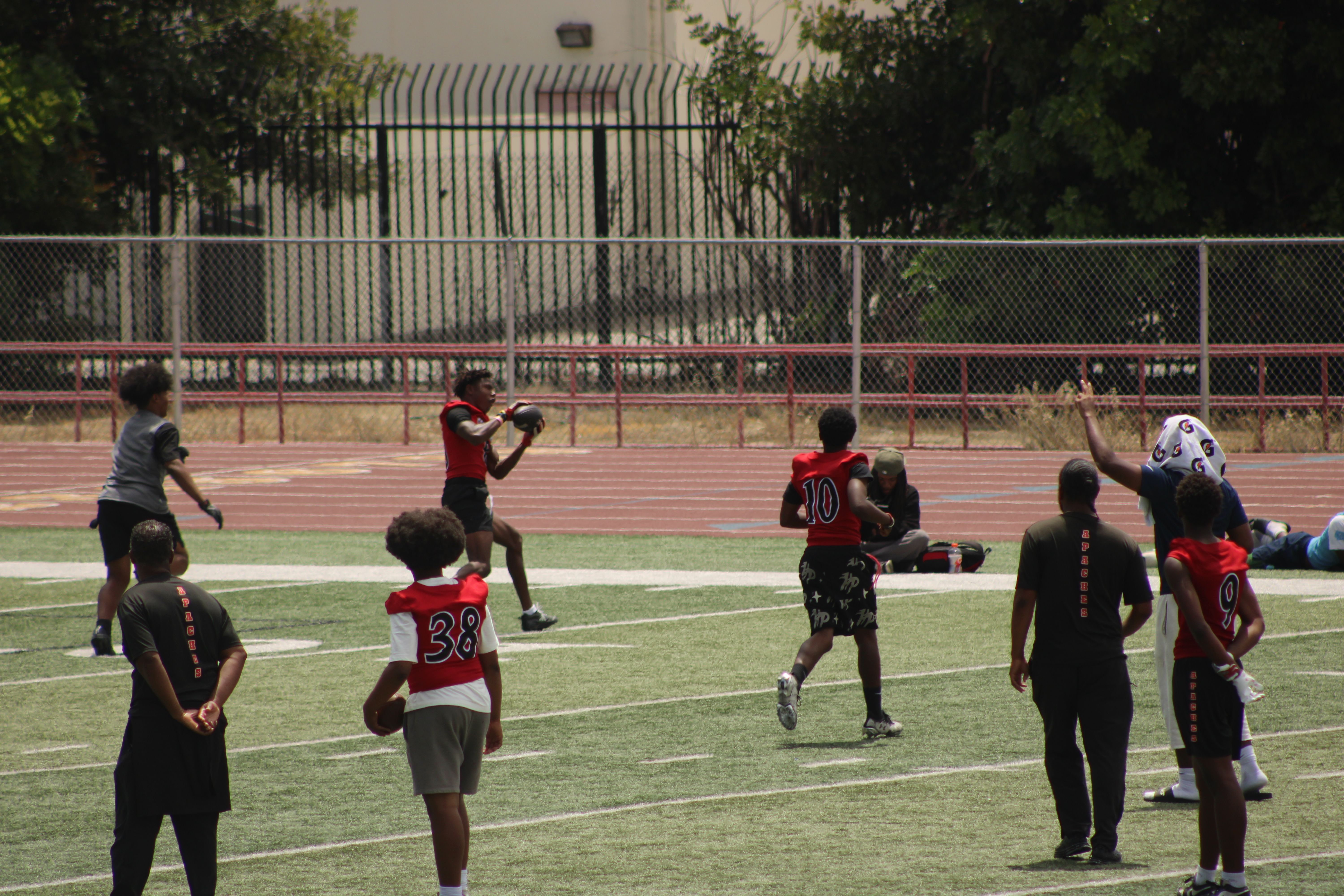 Student-athletes competing during the high school 7v7 football event
