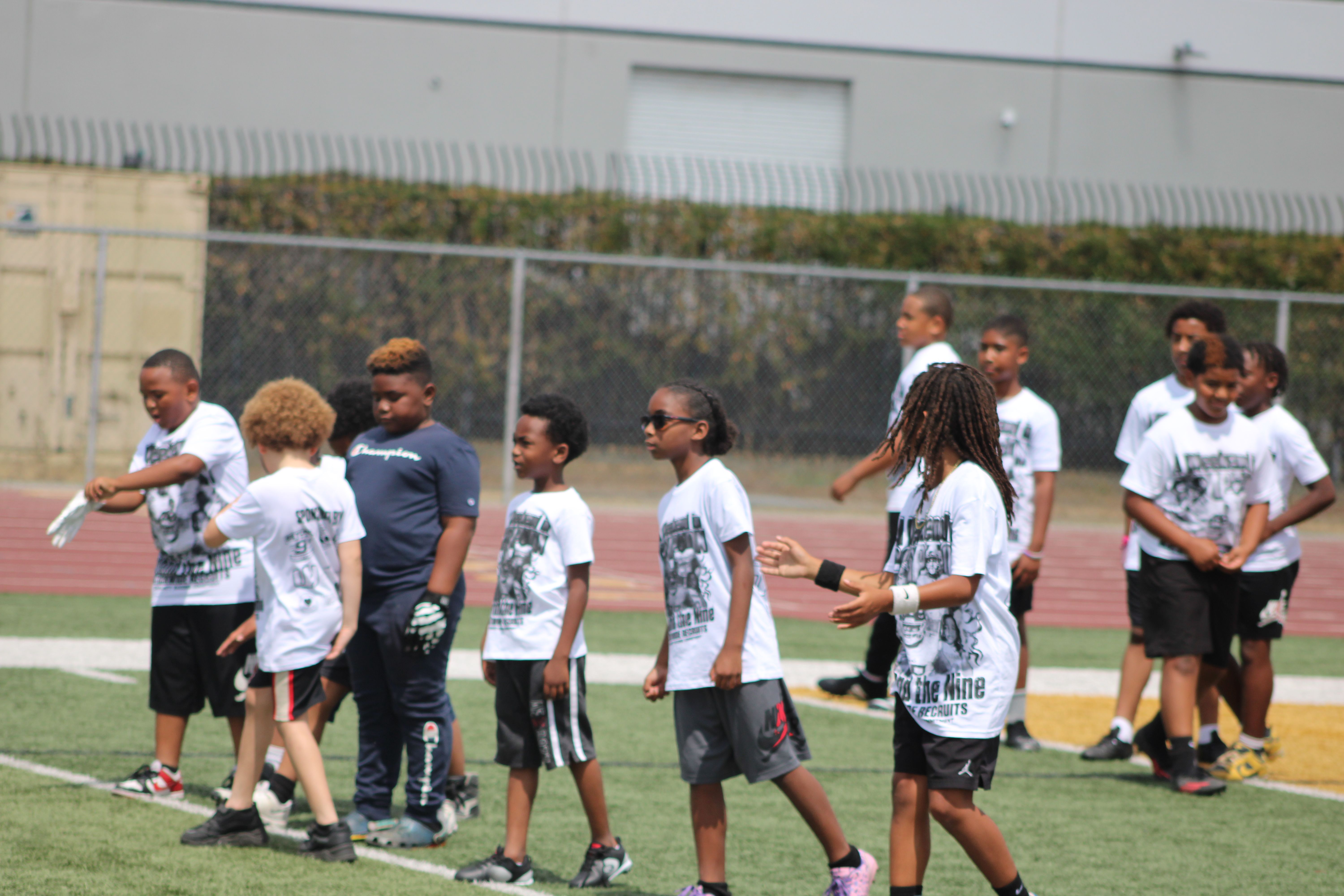 Young athletes participating in the Saturday football camp